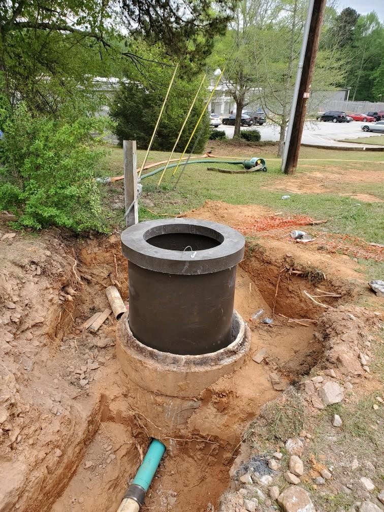 Polymer concrete rehabilitation insert in place before annular fill and backfill