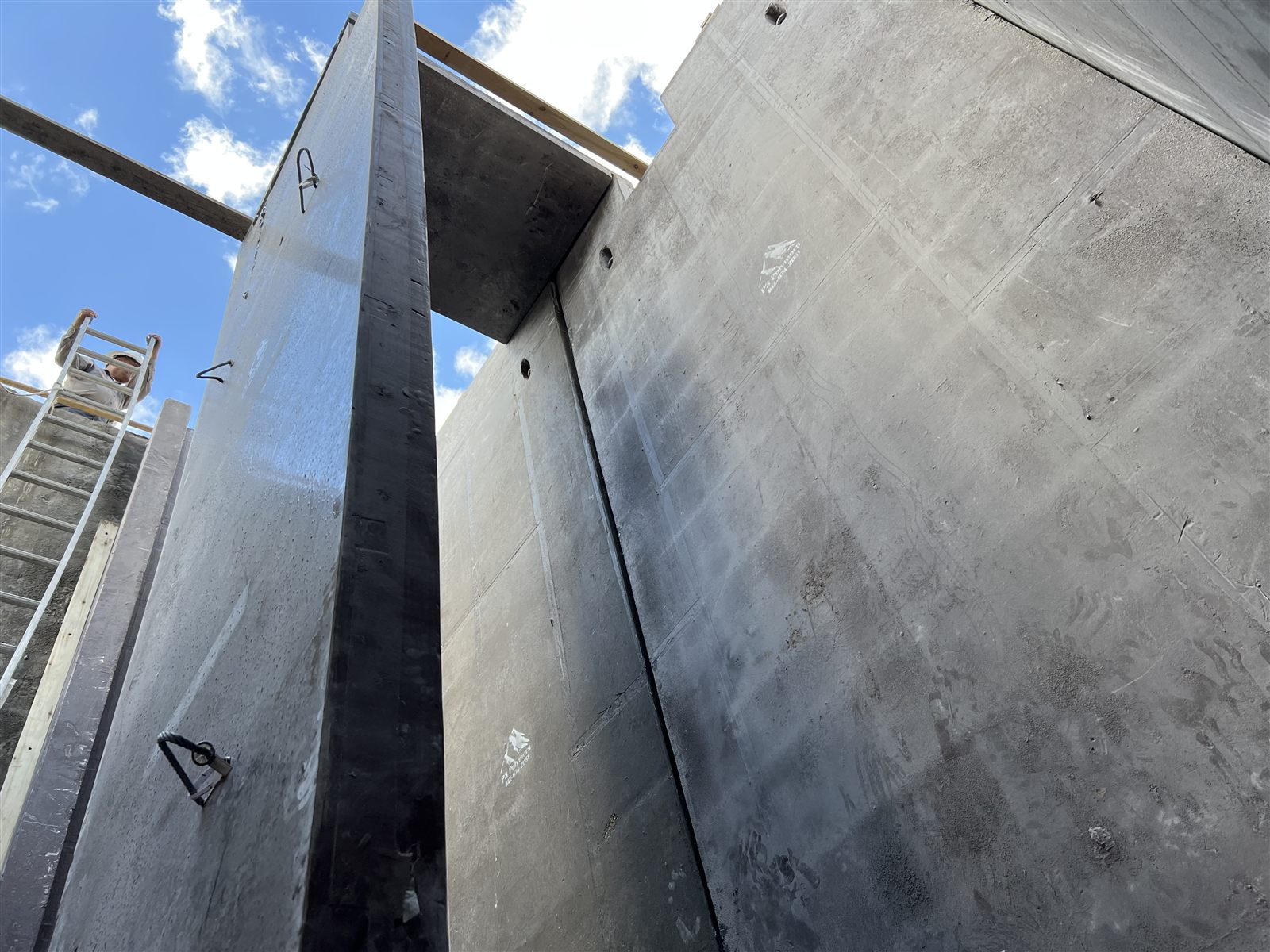 Upward view inside a large polymer concrete structure during field assembly